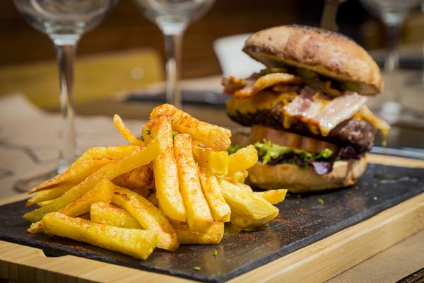 Traditional plate of chips and burger sandwich