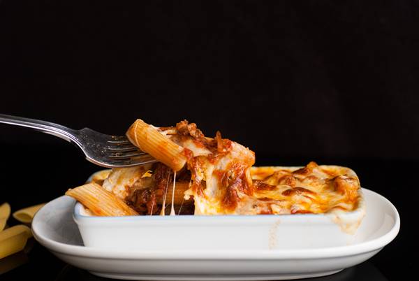 Baked penne pasta with tomato sauce and cheese
